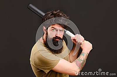 Bearded man with baseball bat. Serious man ready to swing. Baseball player with baseball bat. Stock Photo