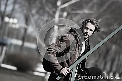 Bearded man in brown hoodie jacket with sport bag Stock Photo