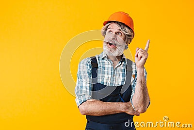 Bearded man builder in helmet have an idea Stock Photo