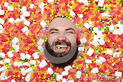 Bearded man in candies Stock Photo