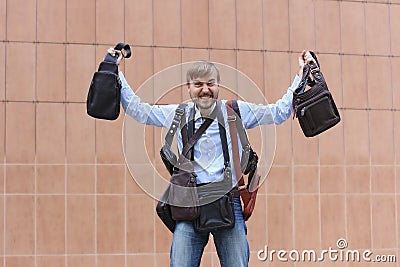 Bearded man happy with the purchase of many leather bags Stock Photo