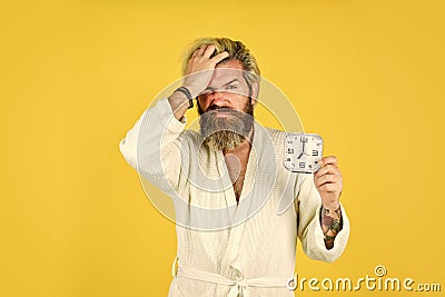 bearded man hate alarm. time management. need to relax. Annoying ringing alarm clock. Break discipline regime. time to Stock Photo