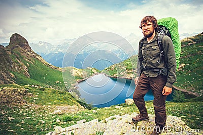 Bearded Man hiker with backpack mountaineering Stock Photo