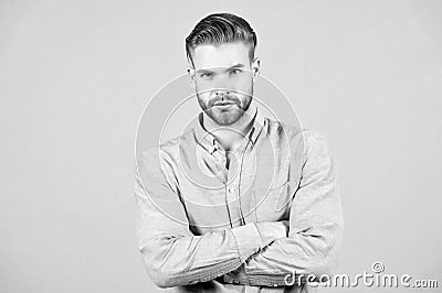 Bearded man keep arms crossed on grey background. Macho with serious face. Tired after everyday work. Office dress code Stock Photo