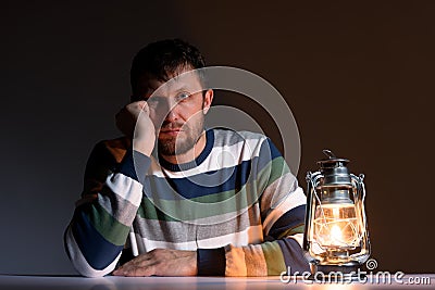 Bearded man and a kerosene lamp Stock Photo