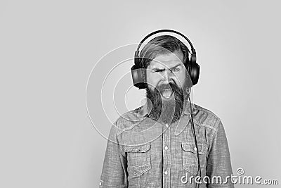 bearded man listen music. brutal hipster wear headphones. online education. just have fun. unshaven guy listening ebook Stock Photo