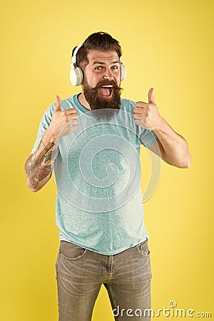 Bearded man listening music wireless gadget. Freedom going wireless offers you is unparalleled. Hipster happy using Stock Photo