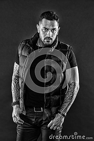 Bearded man posing with tattoos. Brutal strict macho with tattoos. Masculinity and brutality. Tattoo brutal attribute Stock Photo