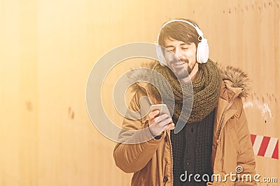 Bearded man smiling listening music instagram tone Stock Photo