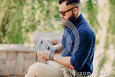 Bearded man travels with map Stock Photo