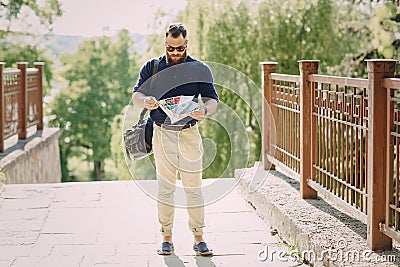 Bearded man travels with map Stock Photo