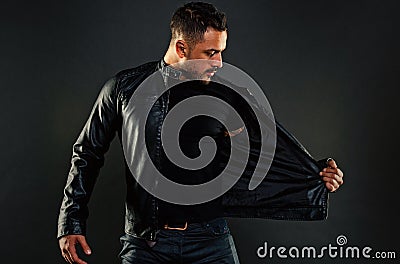 Bearded man undress leather jacket. Man with beard on unshaven face. Fashion model in casual style clothes. Style and Stock Photo