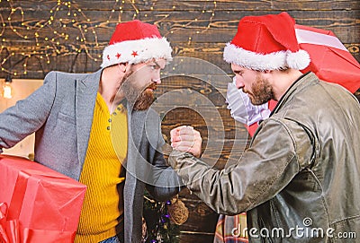 Bearded men carry present boxes. Brutal hipster guys celebrate christmas with gifts. Delivery christmas present Stock Photo