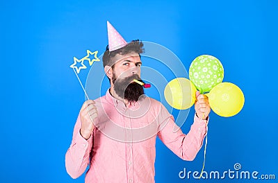 Bearded party entertainer at kids celebration, International children day concept. Man with bright balloons, paper Stock Photo