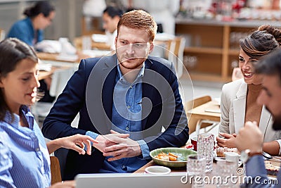 Beardy caucasian with his friends at lunch in restaurant. friends, colleagues, business partners, lunch, break Stock Photo