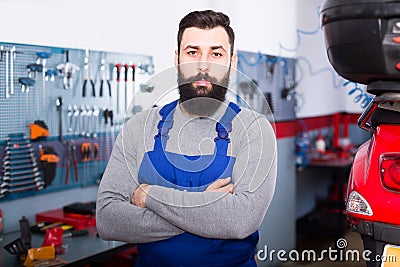 Beardy guy is showing his workplace Stock Photo