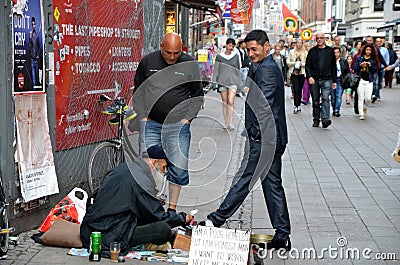 Beardy Shoeshiner Editorial Stock Photo