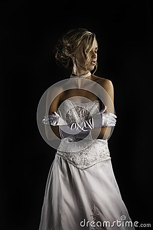 Beatiful bride in wedding dress with gloves Stock Photo