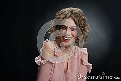 Beatiful curly girl wearing pink dress. Stock Photo