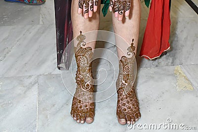 Beatiful mehndi art in legs and feet Editorial Stock Photo