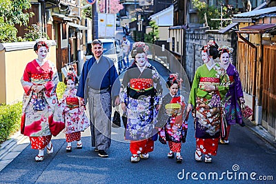 Beatiful woman and two small girls in Maiko kimono dress Editorial Stock Photo