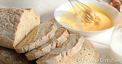 Beating eggs and milk with a whisk in a plate. Dolly shot. Stock Photo