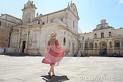 Beautfiul young woman walking in the Cathedral Square of the Baroque City of Lecce, Salento, Italy Stock Photo