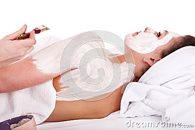 Beautician apply mask to girl. Massage. Stock Photo