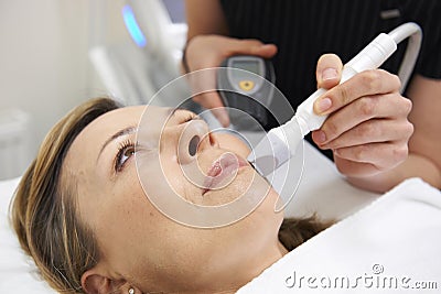 Beautician Carrying Out Ultrasound Skin Rejuvenation Treatment Stock Photo