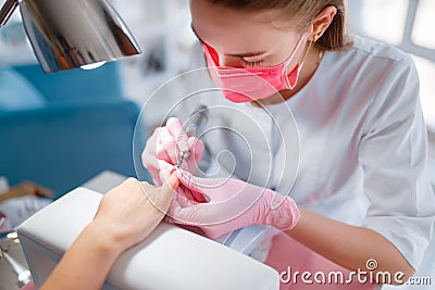 Beautician salon, manicure, nails polish procedure Stock Photo
