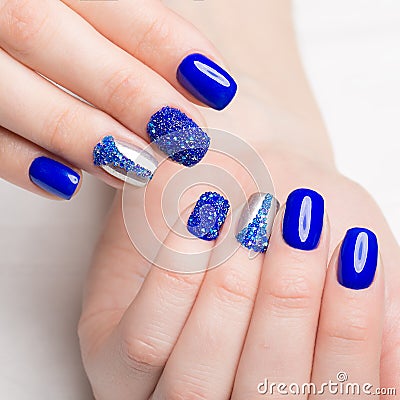 Beautifil blue manicure with rhinestone. Nail Design. Close-up Stock Photo