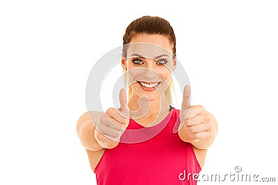 Beautifil young sporty woman shows thumb up as a gesture fo success isolated over white background Stock Photo