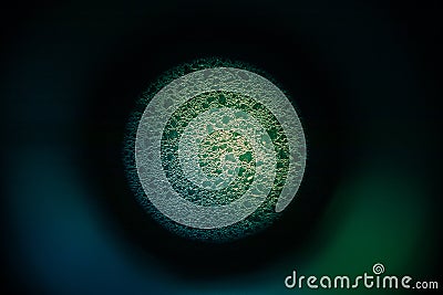 A beautiful, abstract looking sphere with a frosty pattern. Ice frozen on window in a circle design. Stock Photo