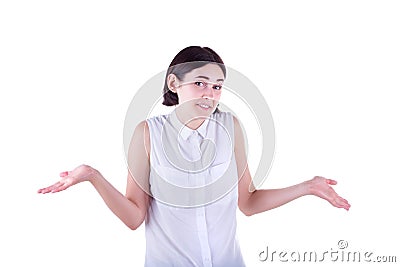 A beautiful and adult girl spreads out her hands in misunderstanding and shrugs shoulders, isolated on the white background. Stock Photo