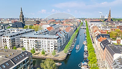 Beautiful aerial view of Copenhagen skyline from above, Nyhavn historical pier port and canal with color buildings and boats Stock Photo