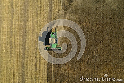 Beautiful aerial view of modern combine harvester working in field. Agriculture industry Editorial Stock Photo