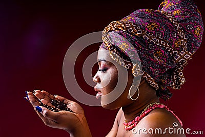 beautiful africa-american woman with turban ower the head in studio Stock Photo