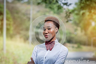 Beautiful Africa Lady in a bow tie Stock Photo