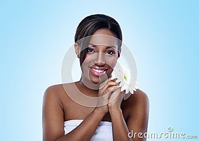 Beautiful African woman with flower Stock Photo
