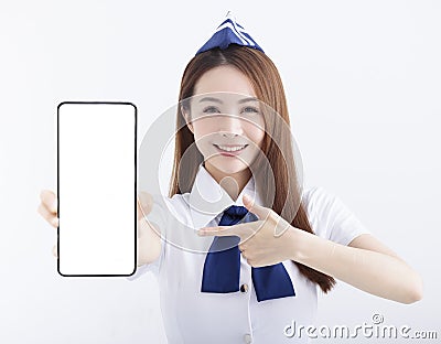 Beautiful Airline stewardess showing the mobile phone with blank screen on white background Stock Photo