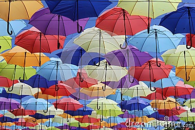 Beautiful alley of multi-colored umbrellas. Editorial Stock Photo