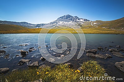 Beautiful alpine clear lake and mountains. Volcano mountain Aragats Armenia Stock Photo
