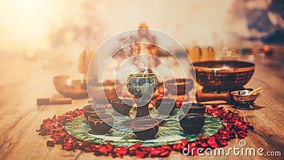 Beautiful altar with rose petals and incense. Cacao ceremony space. Stock Photo