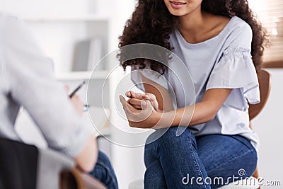 Beautiful american girl during meeting with professional counselor Stock Photo