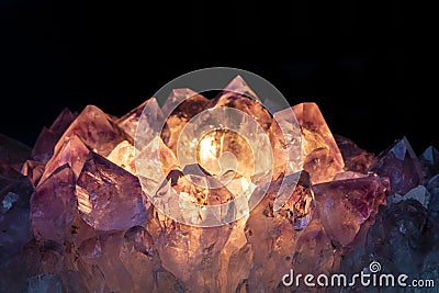 A Beautiful Amethyst Crystal Lit By Candle Light Stock Photo