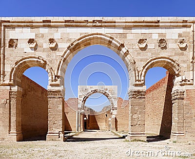 Ancient Roman Arch Ruins at Qasr Al-Mshatta Umayyad Palace in Jordan Stock Photo