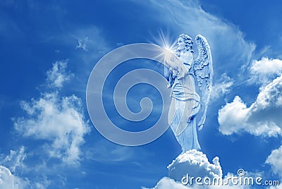 Beautiful angel in heaven with divine rays of light Stock Photo