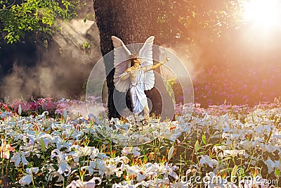 Beautiful angel in a paradise magic garden with white and pink lilies. Valentine`s day greeting card. Flower landscape. Stock Photo
