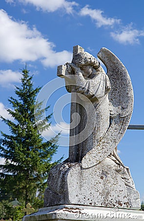 Beautiful angel statue on cemetery Stock Photo
