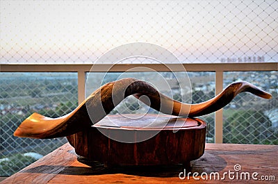 An antelope horn shofar on the wooden board on the balcony Editorial Stock Photo